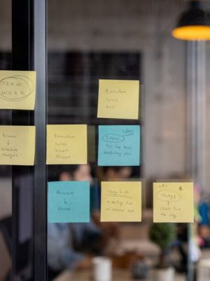 Business strategy written on a board using post its